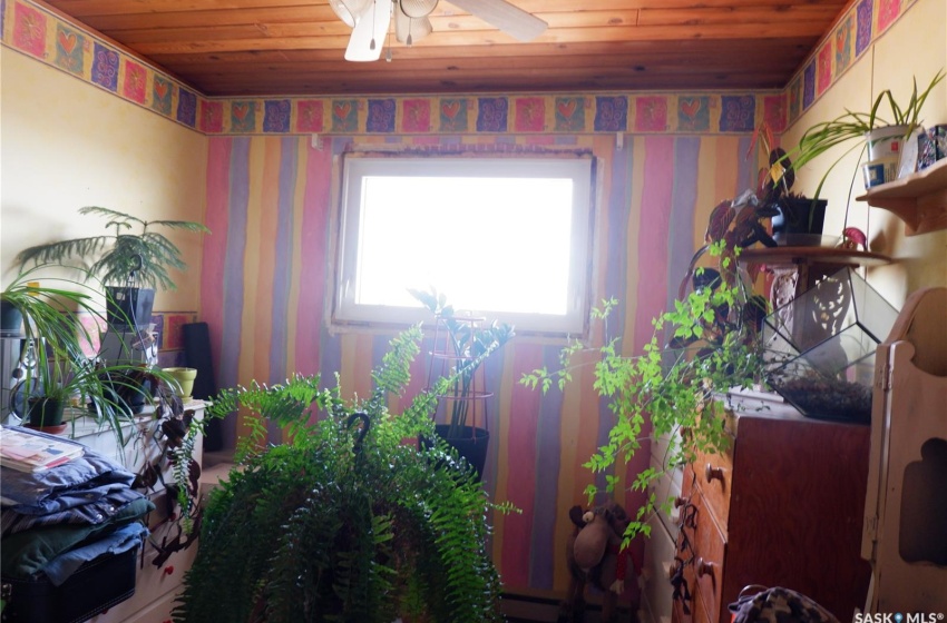 Miscellaneous room featuring ceiling fan and wood ceiling