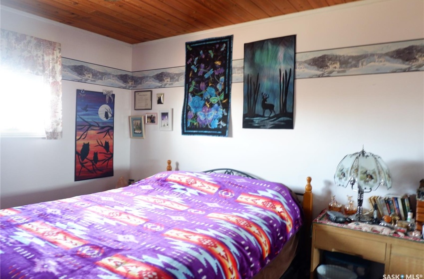 Bedroom with wooden ceiling