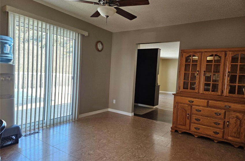 Dining area with Patio doors to deck. Entrance to Hall and Family Room