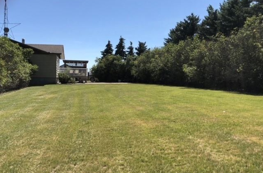 View of yard featuring a wooden deck