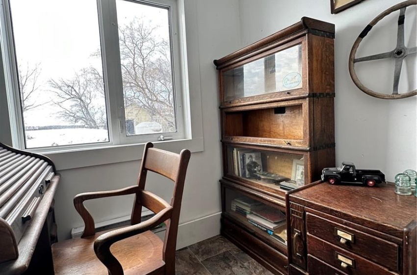 Office featuring dark tile flooring, a textured ceiling, and crown molding