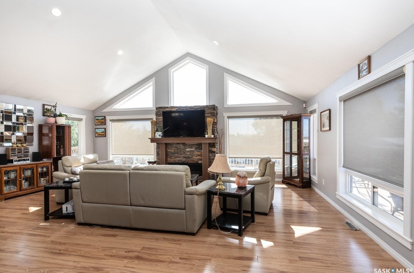 living room facing fireplace and huge windows