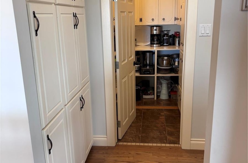 Hallway leading to walk in pantry