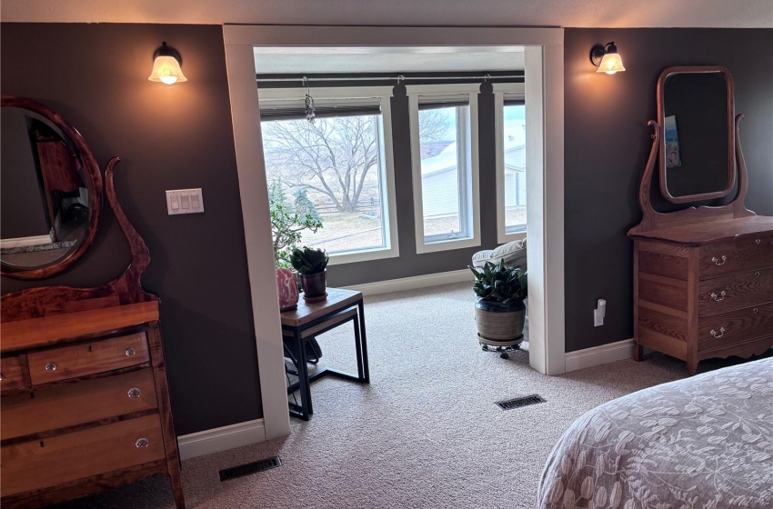 View going from bedroom into sunroom