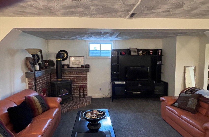 Basemant Rec room featuring carpet and a nat. gas stove