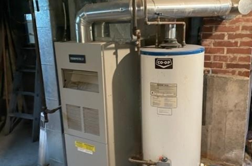 Utility room with water heater and heating utilities