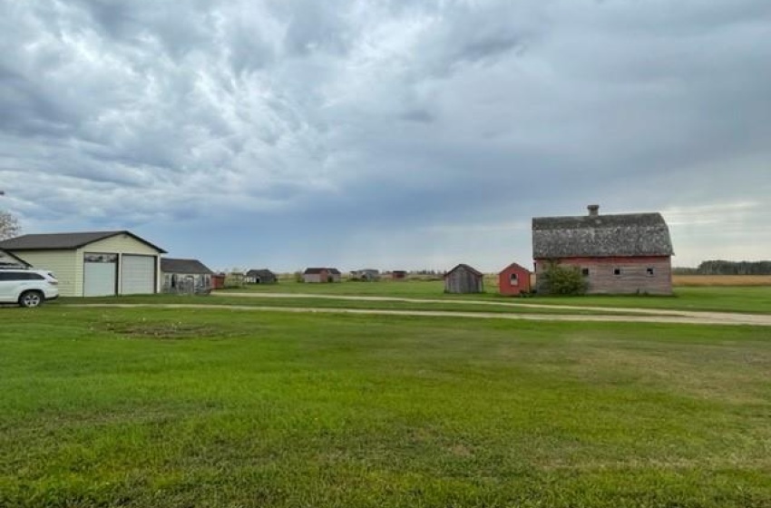 View of yard with an outdoor structure and a garage