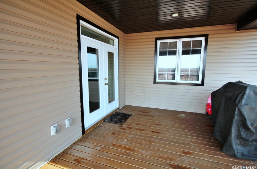 Wooden deck featuring french doors