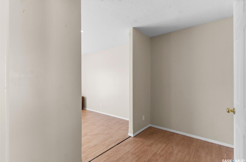 Spare room with light hardwood / wood-style floors and a textured ceiling