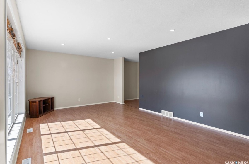 Unfurnished room with light hardwood / wood-style flooring