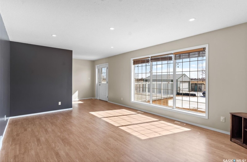 Spare room with light wood-type flooring and plenty of natural light