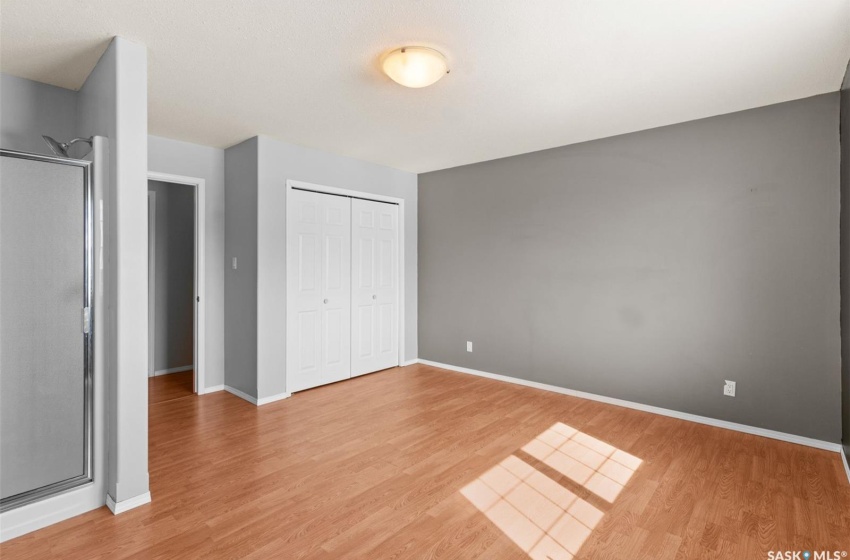 Unfurnished bedroom featuring light hardwood / wood-style floors and a closet