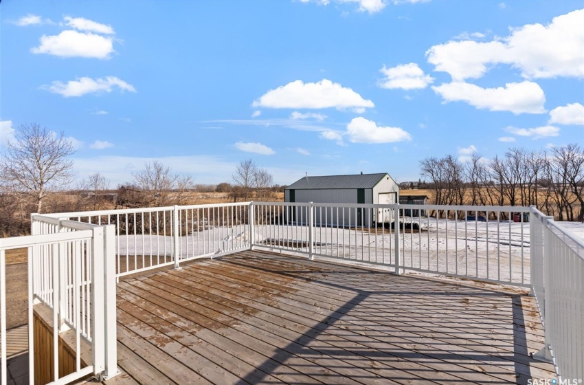 Deck with an outdoor structure and a garage