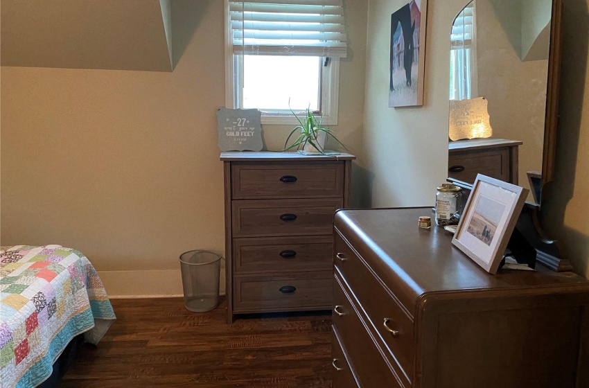 Primary Bedroom with dark hardwood / wood-style floors