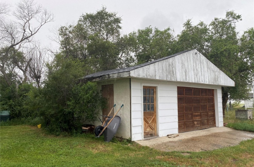 Garage with a lawn