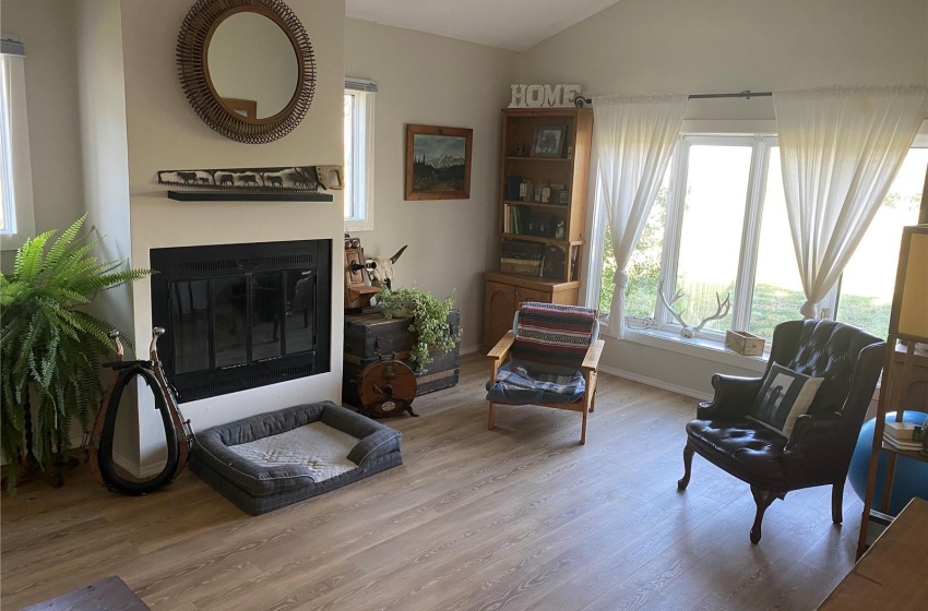 Living room with lofted ceiling and light wood-type flooring