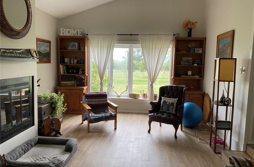 Living area featuring light hardwood / wood-style flooring and lofted ceiling