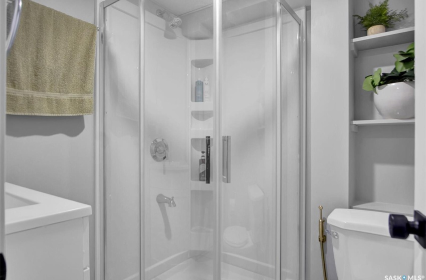 Bathroom with an enclosed shower and toilet