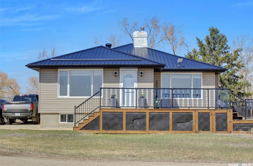 View of front of home with a wooden deck