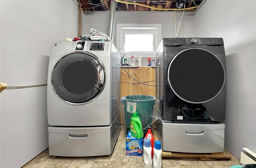 Laundry in mechanical with companion NG boiler and 2024 stainless steel tank with lifetime warranty