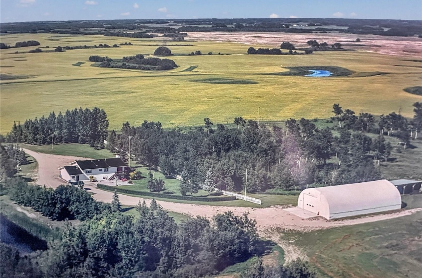 An older aerial view before a large hail storm and the exterior fo the home was updated.