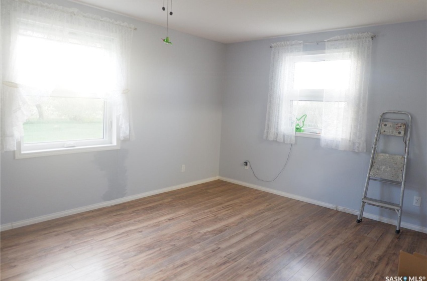 Spare room with a healthy amount of sunlight and hardwood / wood-style floors