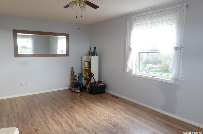 Miscellaneous room featuring ceiling fan and hardwood / wood-style floors