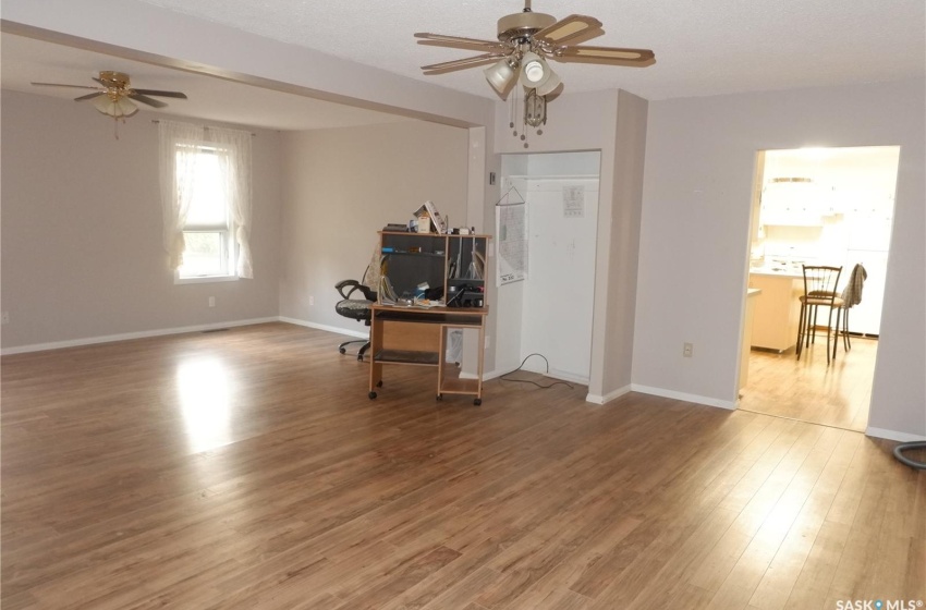 Unfurnished office featuring ceiling fan and hardwood / wood-style floors