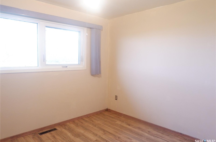 Unfurnished room featuring wood-type flooring