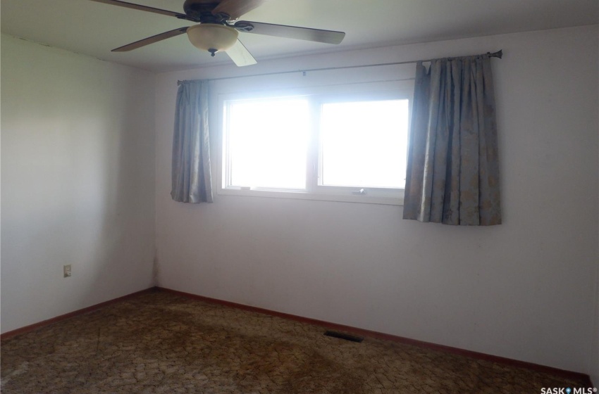 Unfurnished room with ceiling fan and carpet floors