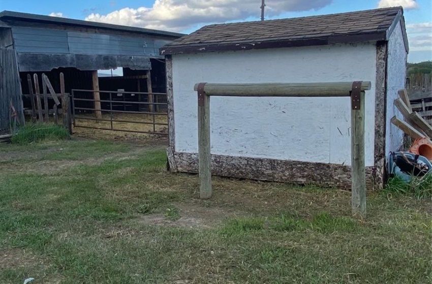 View of outdoor structure with a yard