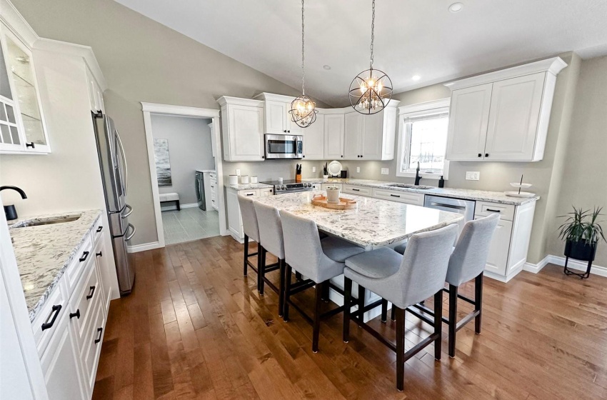 Custom white kitchen with rich quartz countertops