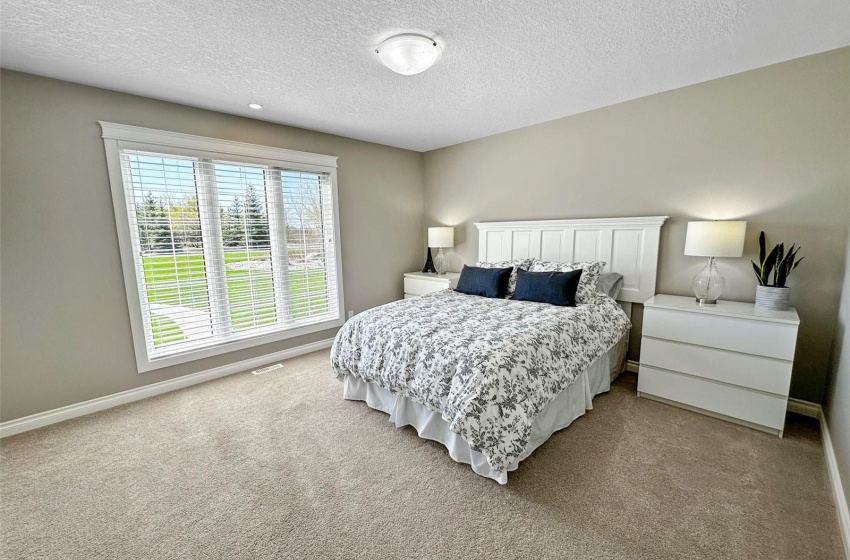 Oversized bedroom that is sunsoaked by the large south window.