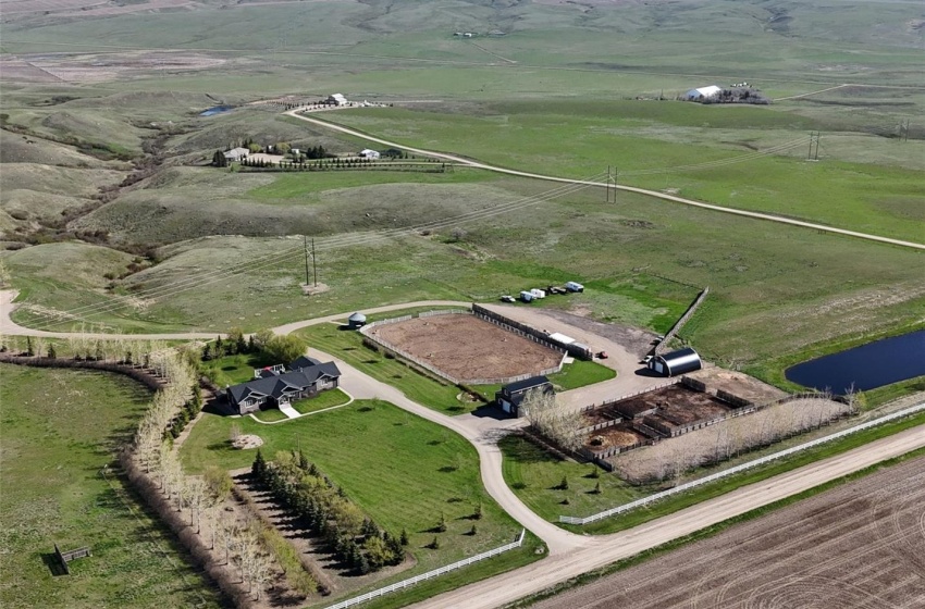 40.05 Acres 1.2 km from Swift Current with 2 yard sites with full services including city water. A dugout to the southeast, paved lane, shop, barn, riding arena and corrals.