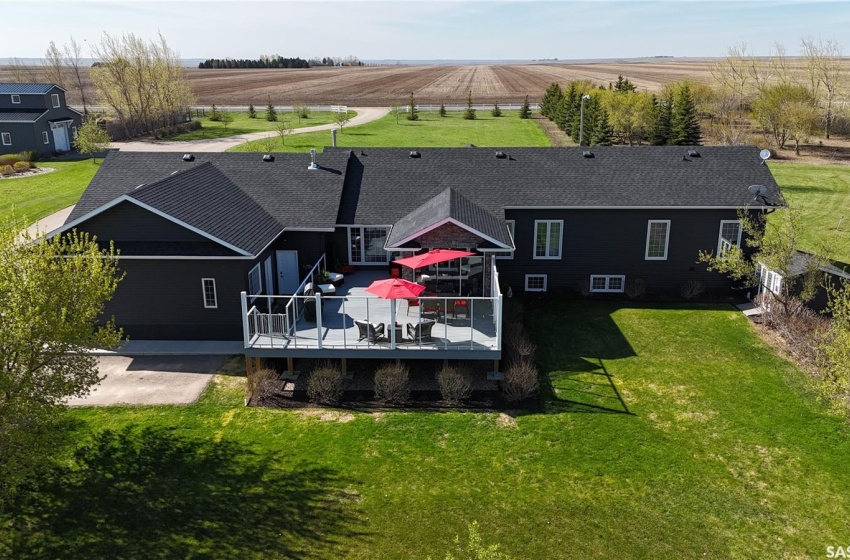 The expansive deck to the north has a border of mature trees providing privacy. Shed to the west.