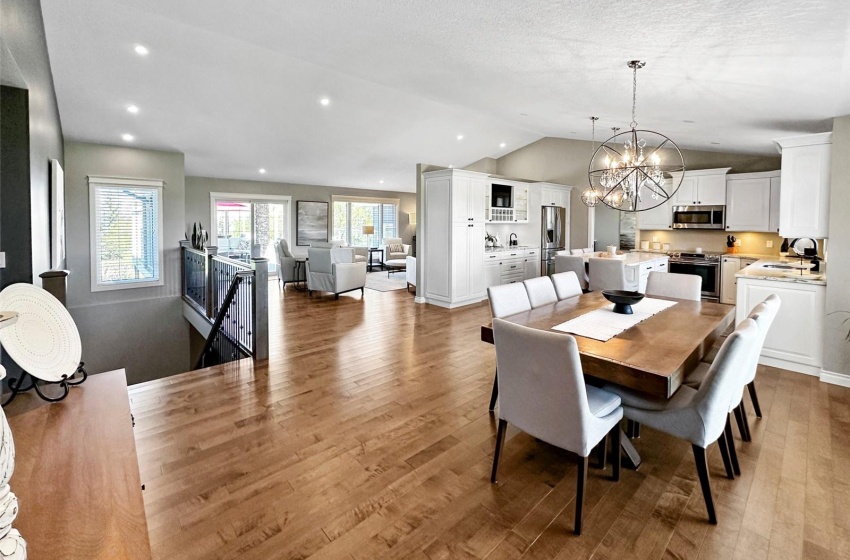 The open concept floorplan features an abundance of living space, a vaulted ceiling and recessed lighting in addition to the contempoary fixtures. Throughout the entire home you will find extra LARGE windows that allow for tons of natural light!