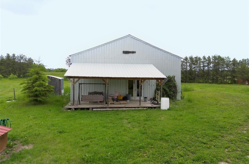 Rear view of house featuring a lawn