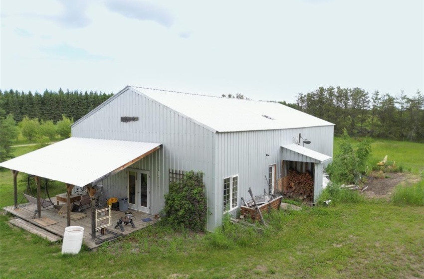 Back of property featuring a patio area and a yard