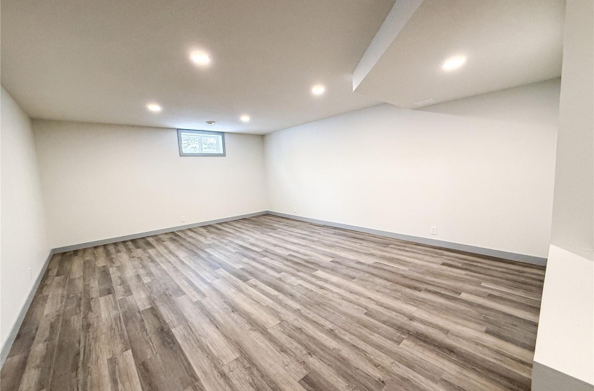 Basement featuring light hardwood / wood-style flooring