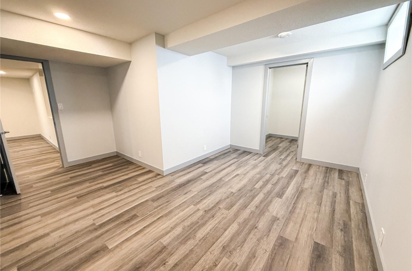 Basement featuring light hardwood / wood-style floors