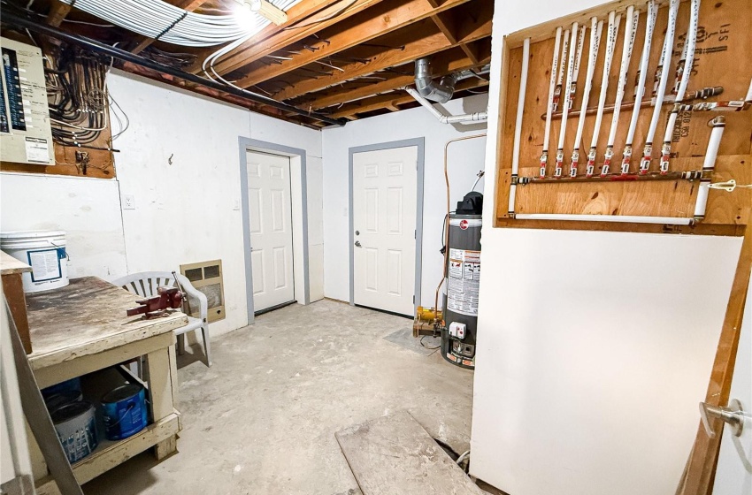 Basement featuring gas water heater