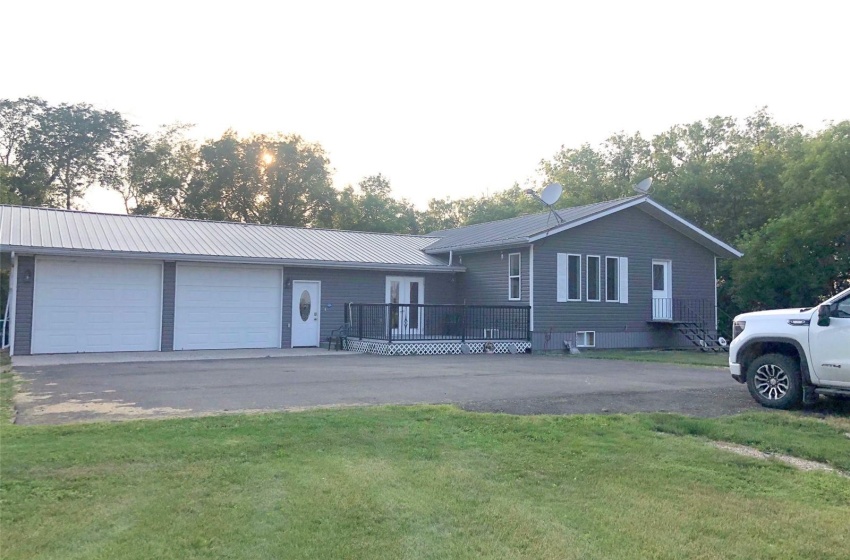 Ranch-style house with a garage and a front yard