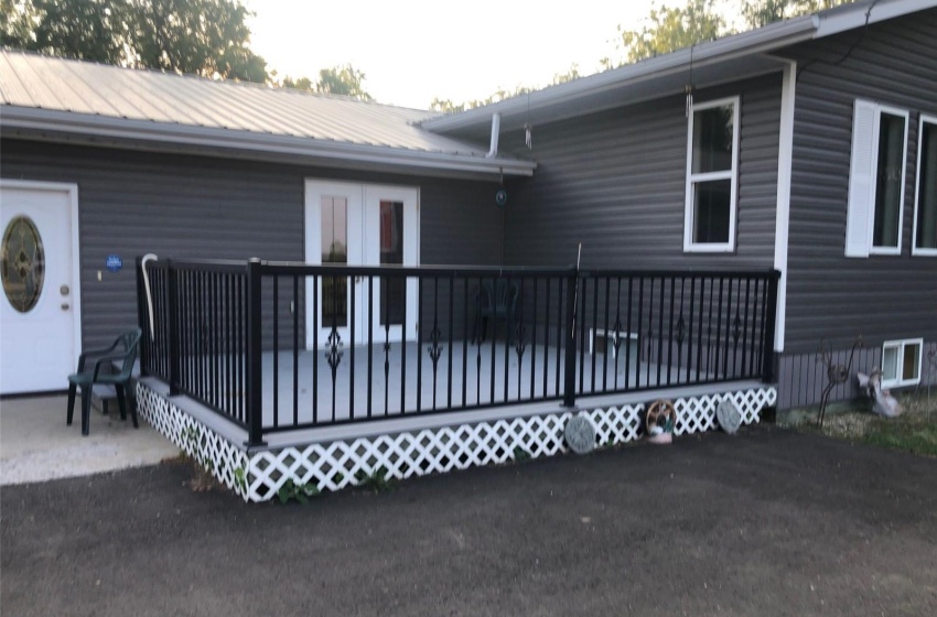 Back of property with a wooden deck