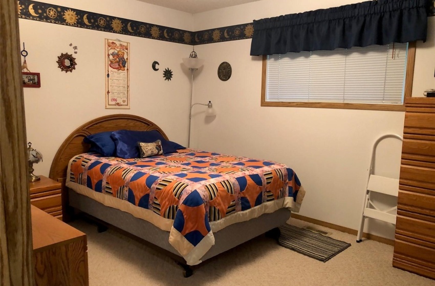 Bedroom featuring carpet floors and a textured ceiling