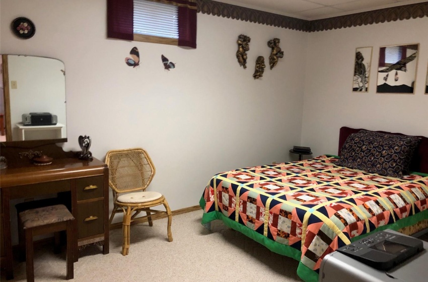 Carpeted bedroom with a drop ceiling