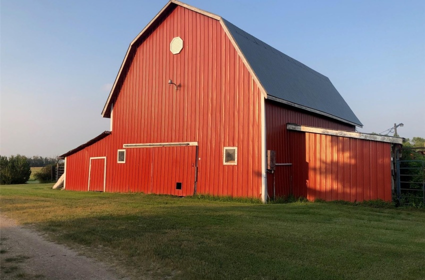 View of outbuilding featuring a yard