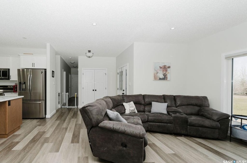 Living room featuring a textured ceiling and light wood-type flooring