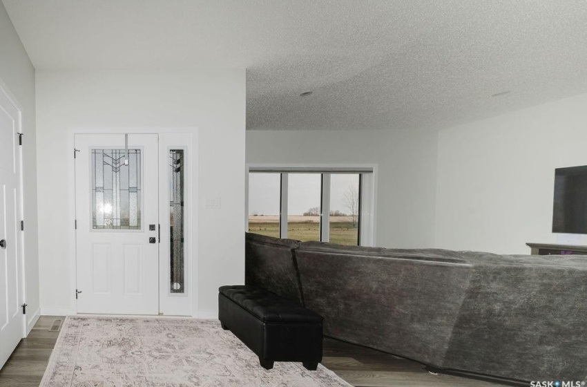 Entryway featuring hardwood / wood-style floors and a textured ceiling