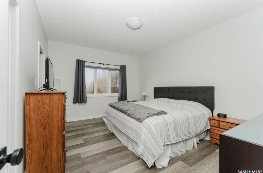 Bedroom featuring a textured ceiling and light wood-type flooring