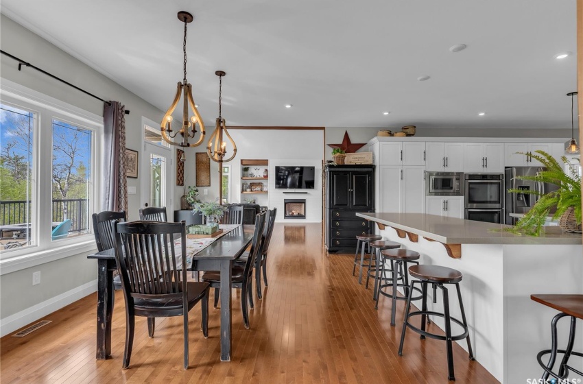 Dining room with hardwood flooring and a chandelier